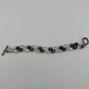 Wire bracelet with clear and black bracelets
